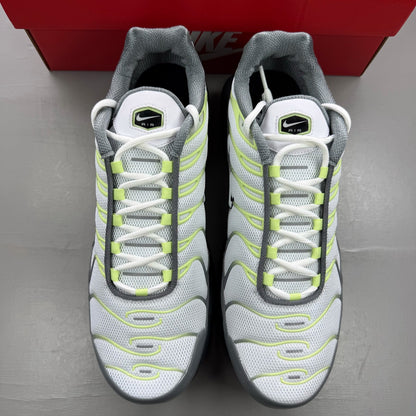 Nike trainers white with cool grey and liquid lime accents, featuring iconic swoosh logo.
