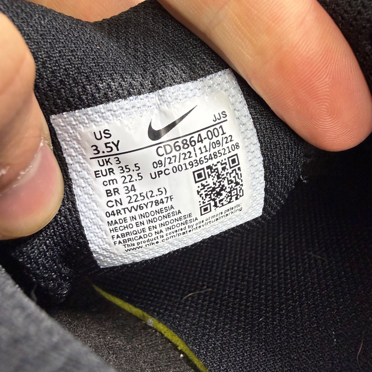 Nike black athletic shoes leather with Air Max logo and triple black design.