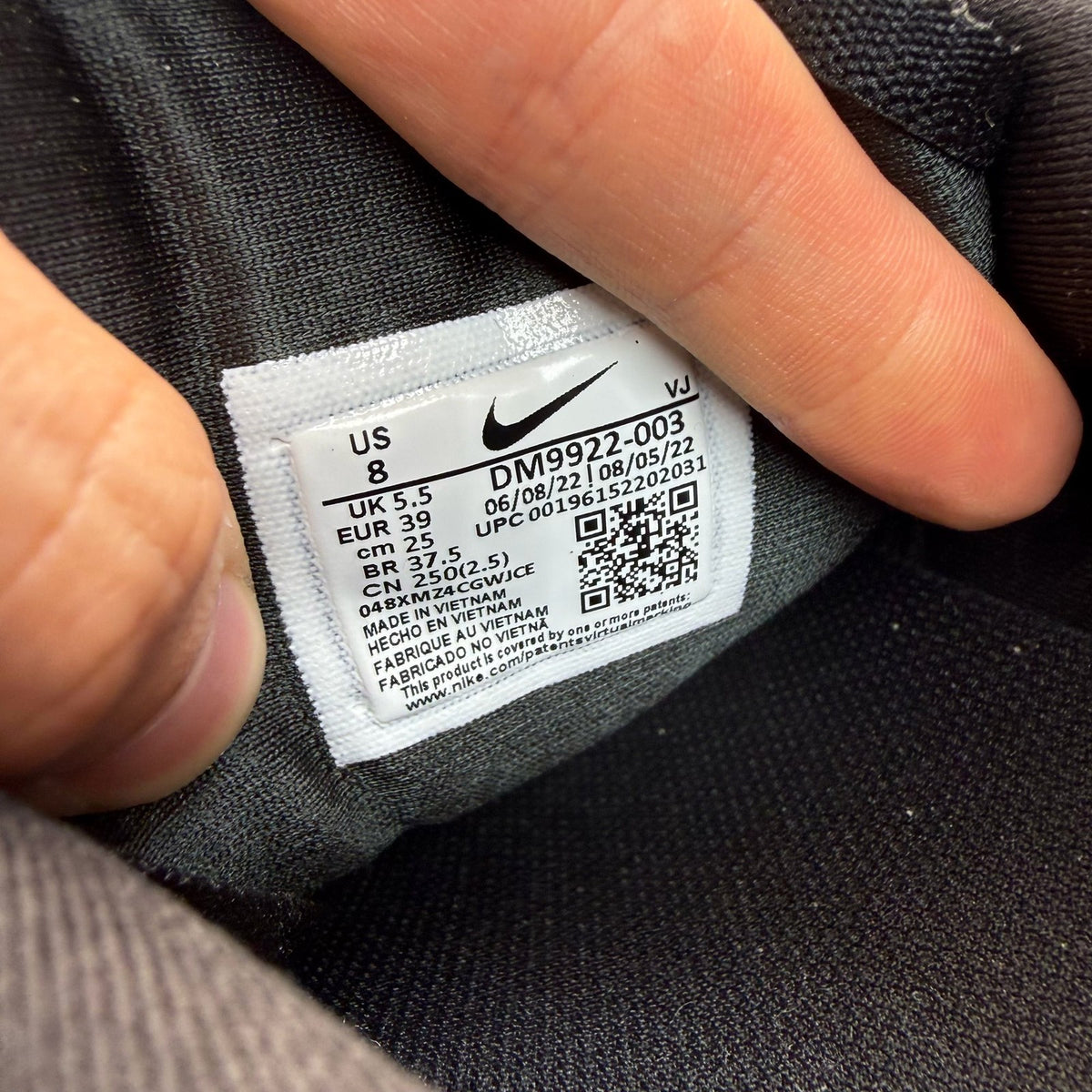 Nike black Air Max 90 Futura trainers with grey accents and logo detail.