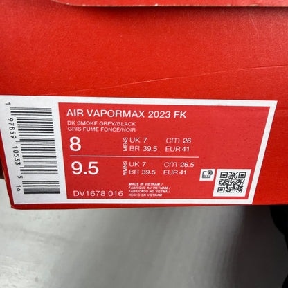 Nike athletic shoes grey Flyknit upper with Air VaporMax sole and logo detail.