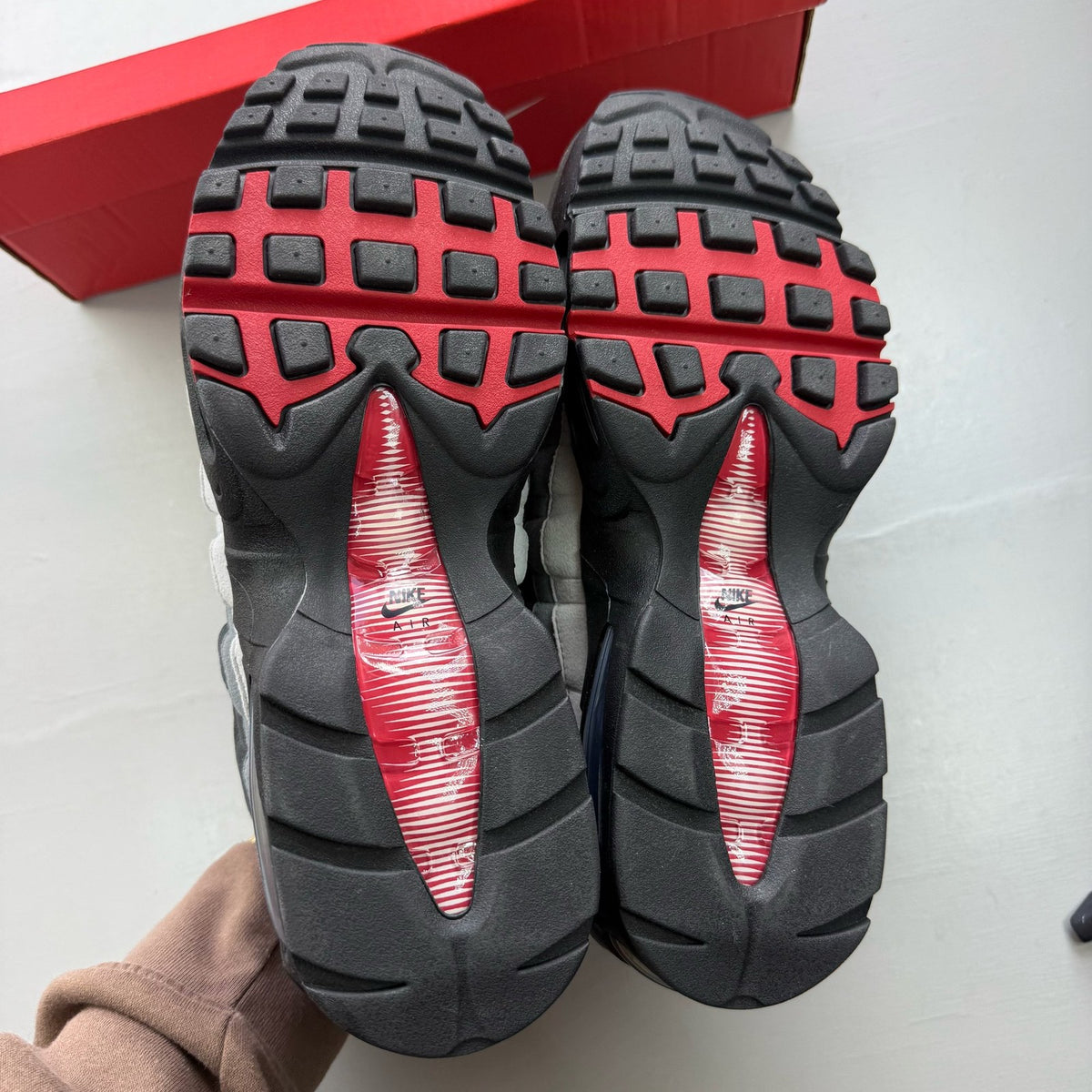 Nike Air Max 95 black trainers with Liverpool FC logo and big bubble sole.