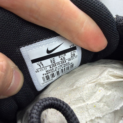 Nike black Air Max 97 trainers with country camo pattern and logo details.