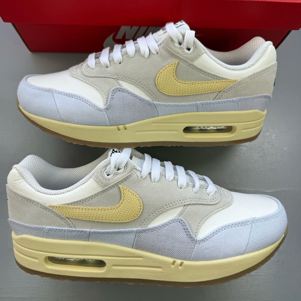 Nike Air Max 1 trainers beige with crepe sole and subtle logo detailing.