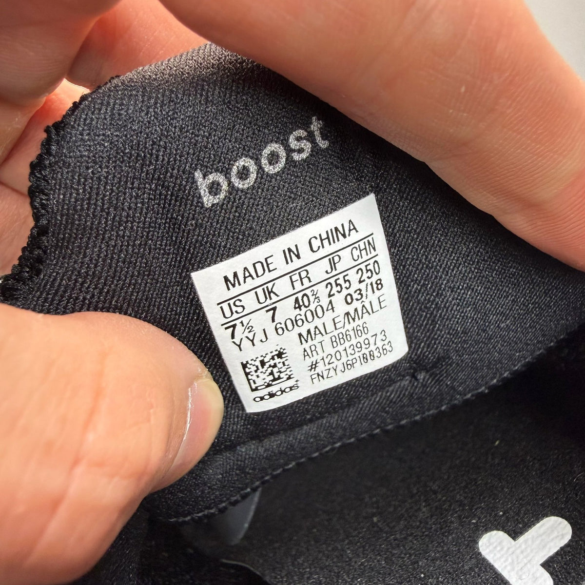 Adidas Ultra Boost 4.0 black running trainers with white accents and logo detail.