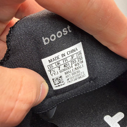 Adidas Ultra Boost 4.0 black running trainers with white accents and logo detail.