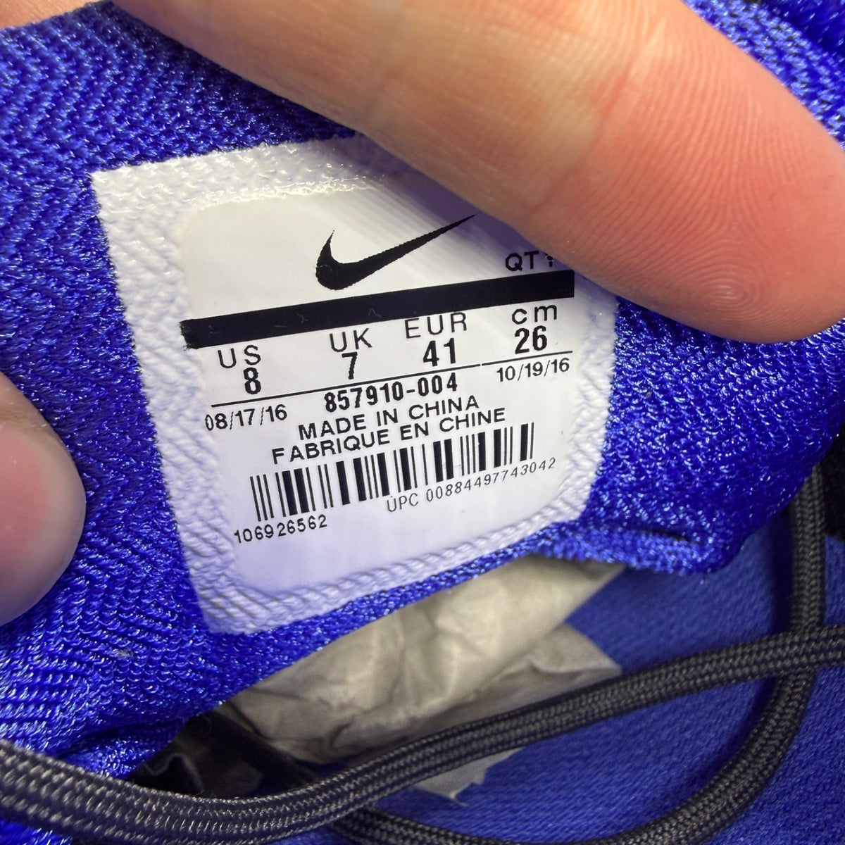 Nike Air Max 95 Ultra black trainers with blue accents and mesh upper.