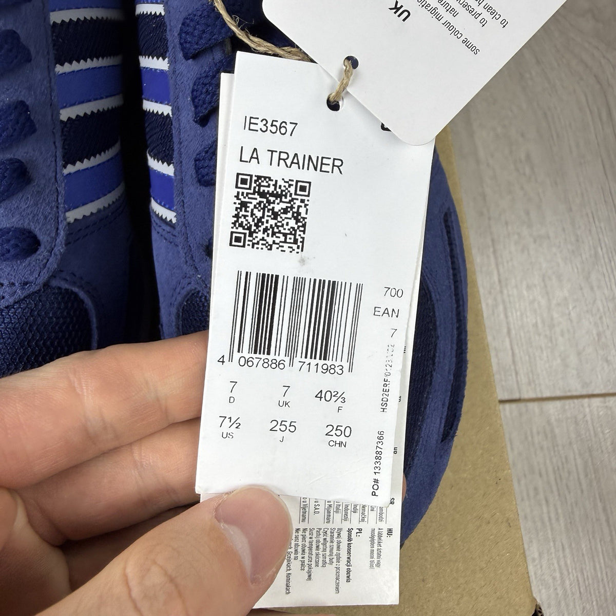 Adidas blue LA Trainers with white stripes and logo detailing on the side.