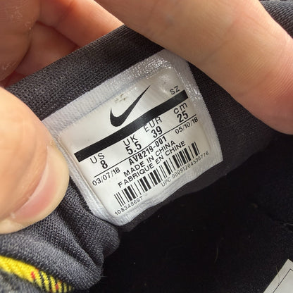 Nike Air Max 1 SE trainers black with tartan pattern and yellow accents.