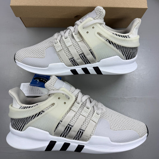 Adidas grey athletic shoes with mesh upper and signature three stripes logo.