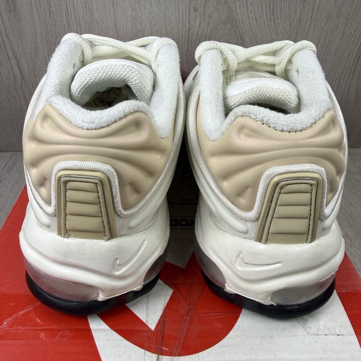 Nike Air Max Deluxe SE beige trainers with unique pattern and logo details.