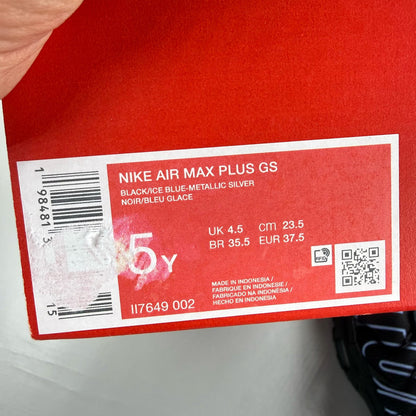 Nike Air Max Plus TN Tuned black trainers with grey accents and signature logo.
