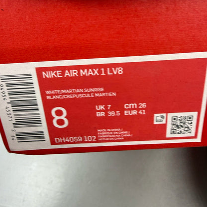 Nike Air Max 1 white trainers with grey accents and Martian Sunrise detailing.