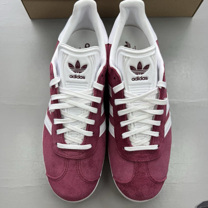 Adidas Gazelle trainers burgundy with white and gold accents, classic suede material.