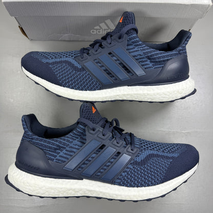 Adidas running shoes blue with Boost cushioning and iconic three-stripe logo.