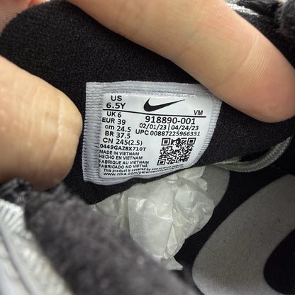 Nike Air Max 97 silver trainers with metallic finish and signature swoosh logo.