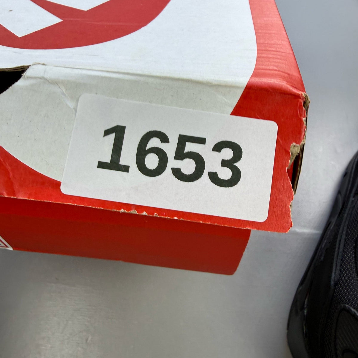Nike Air Max 90 trainers black with signature logo and sleek design.