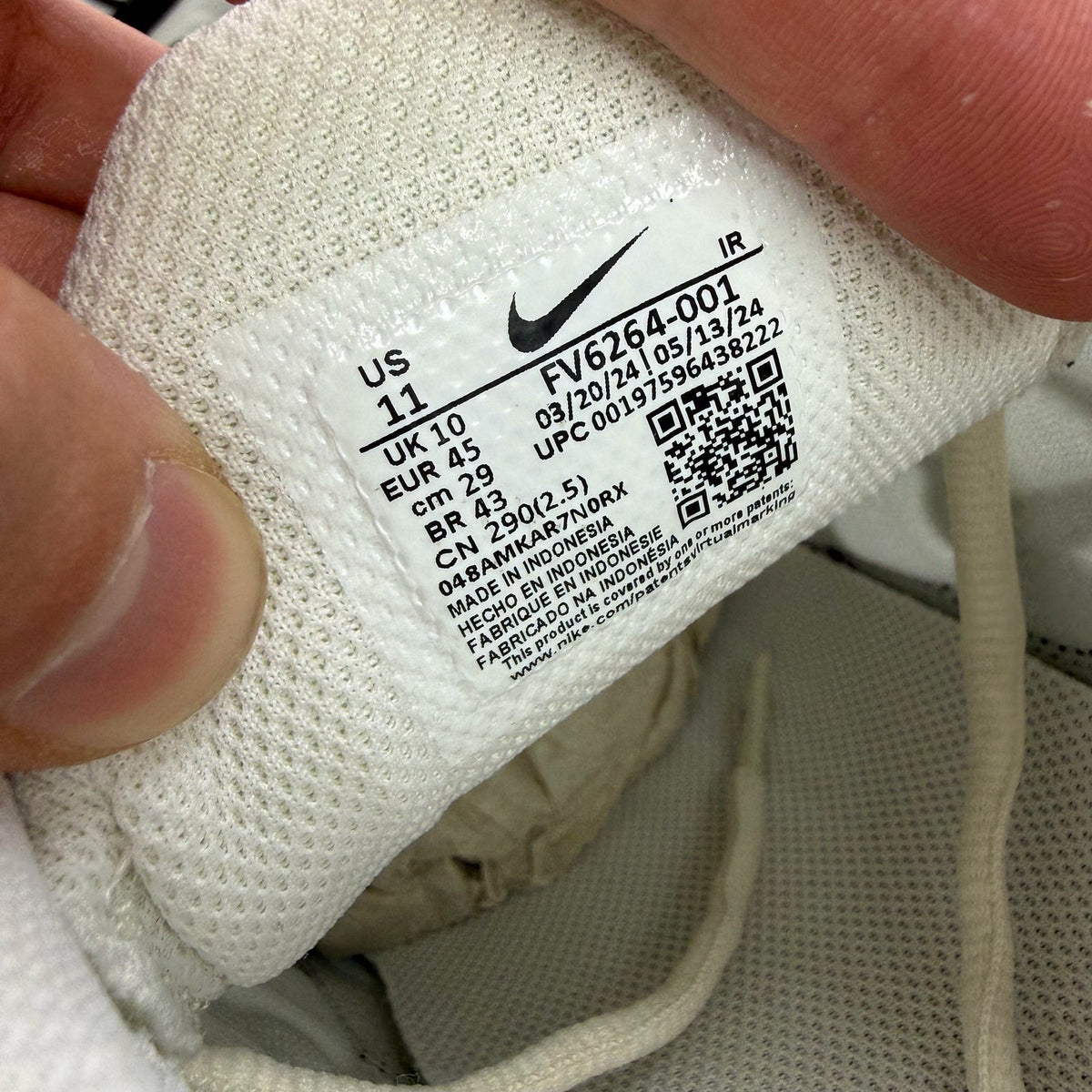 Nike Air Max Plus TN trainers white with black accents and signature logo.