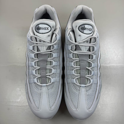 Nike Air Max 95 white trainers with big bubble sole and reflective detailing.