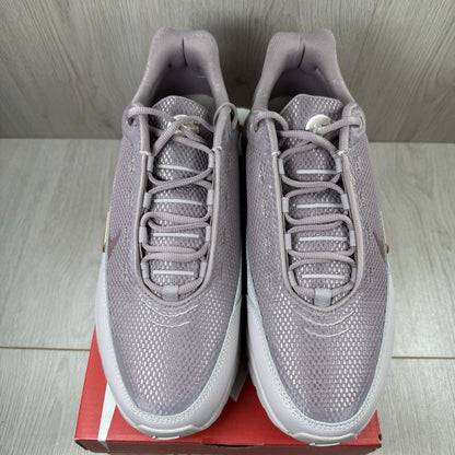 Nike Air Max Pulse purple trainers with unique design and textured material.