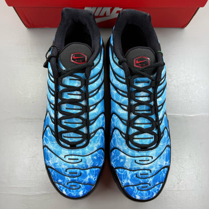 Nike Air Max Plus TN blue trainers with shark attack pattern and iconic swoosh logo.
