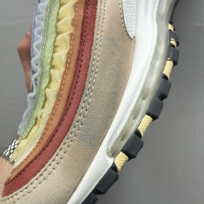 Nike Air Max 97 trainers white with pink accents and beige detailing, authentic design.