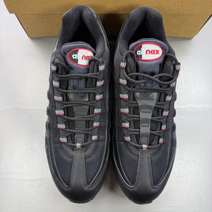 Nike Air Max 95 black trainers with red accents and signature big bubble sole.