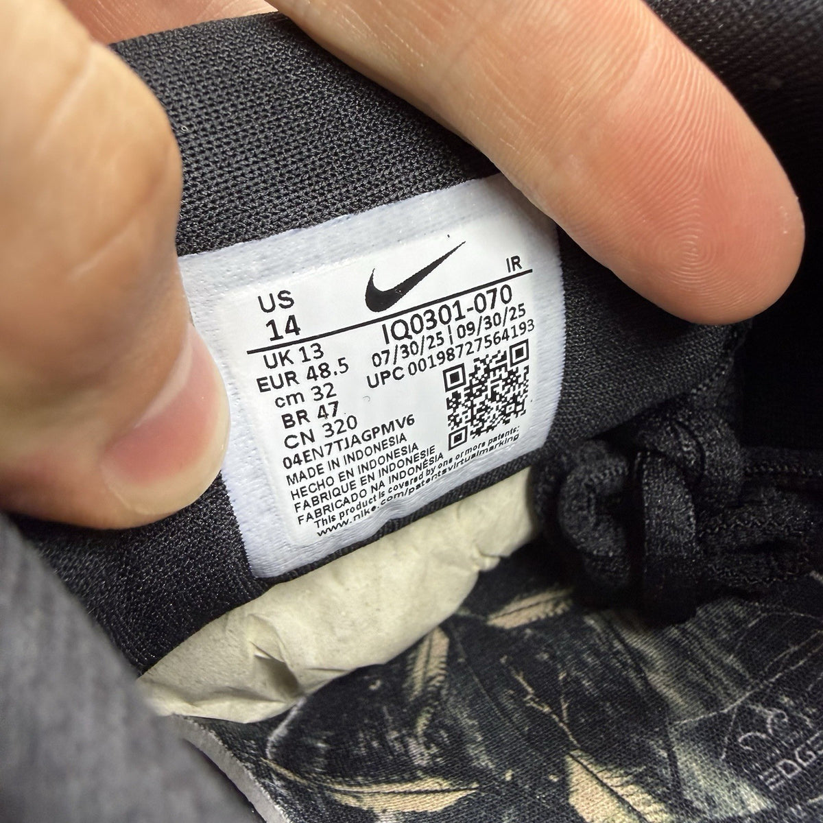 Nike black trainers featuring wood camo pattern and Air Max Plus design.
