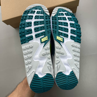 Nike Air Max 90 white golf shoes with bright spruce and volt accents, authentic design.