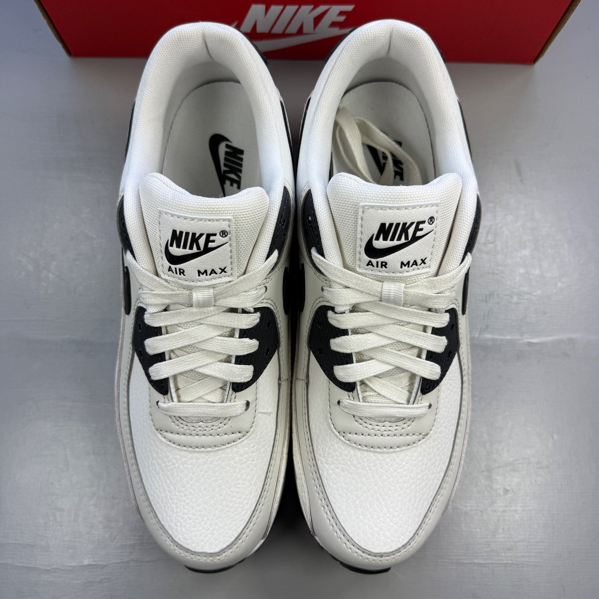 Nike deck shoes white with croc print texture and logo detail.