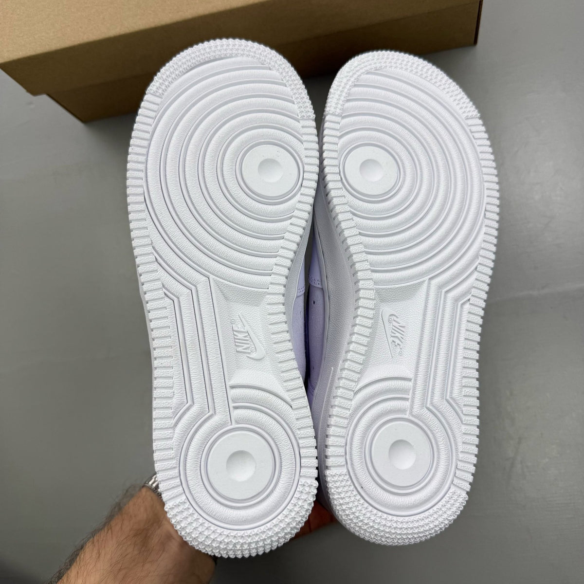 Nike Air Force 1 '07 purple trainers with classic white sole and logo detail.