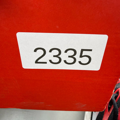 Nike Air Max Plus TN black trainers with white and university red accents, mesh material.