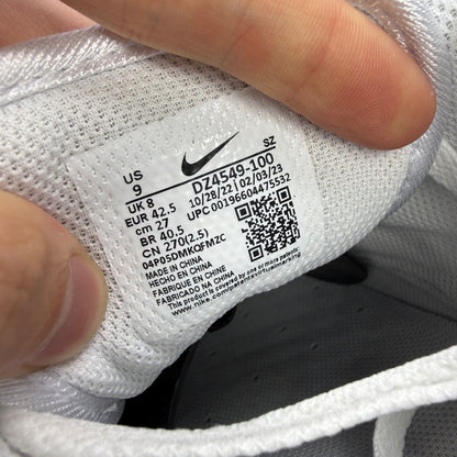 Nike trainers white with grey accents and green detailing, featuring iconic swoosh logo.