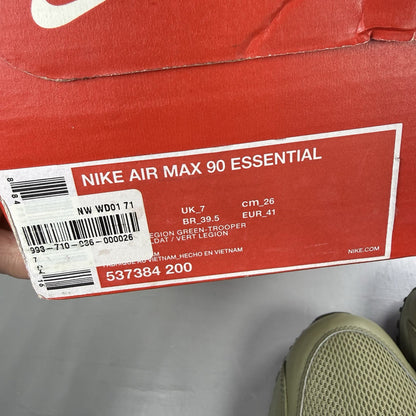 Nike Air Max 90 Essential green trainers with khaki accents and signature swoosh logo.