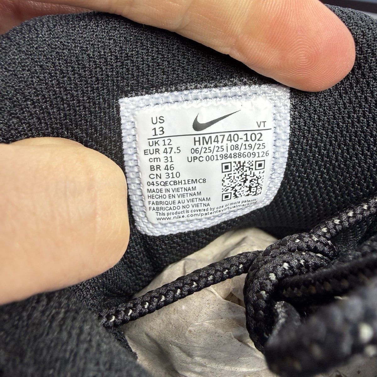 Nike Air Max 95 trainers black with white and saffron accents, featuring iconic logo.
