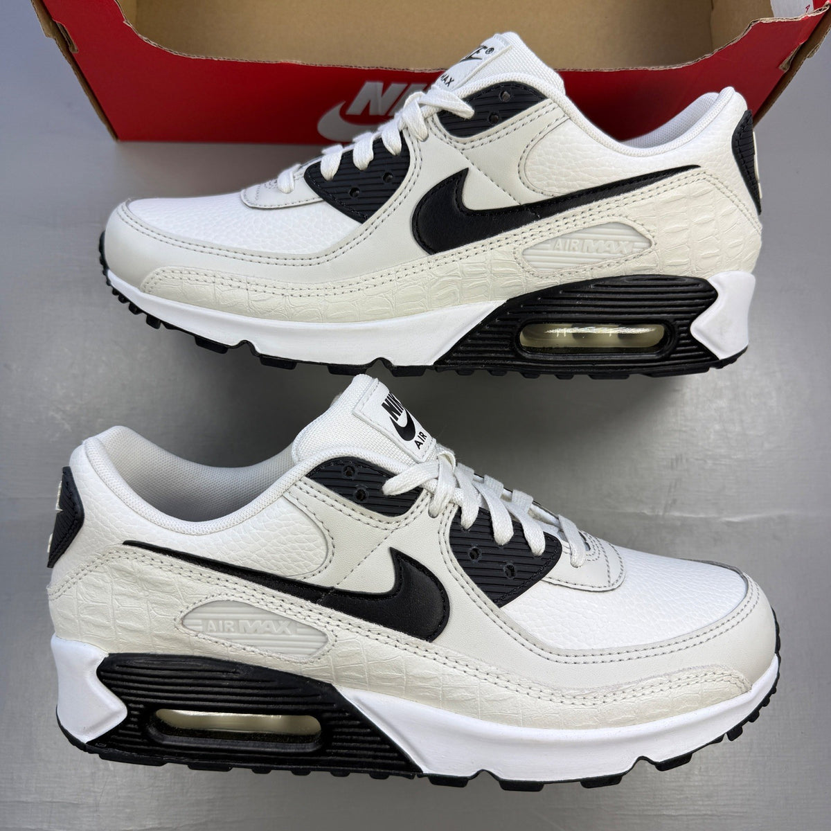 Nike deck shoes white with croc print texture and logo detail.