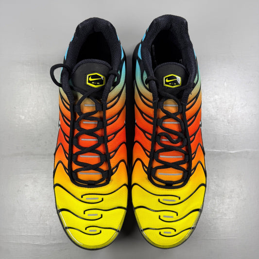Nike running shoes blue with safety orange accents and signature logo.