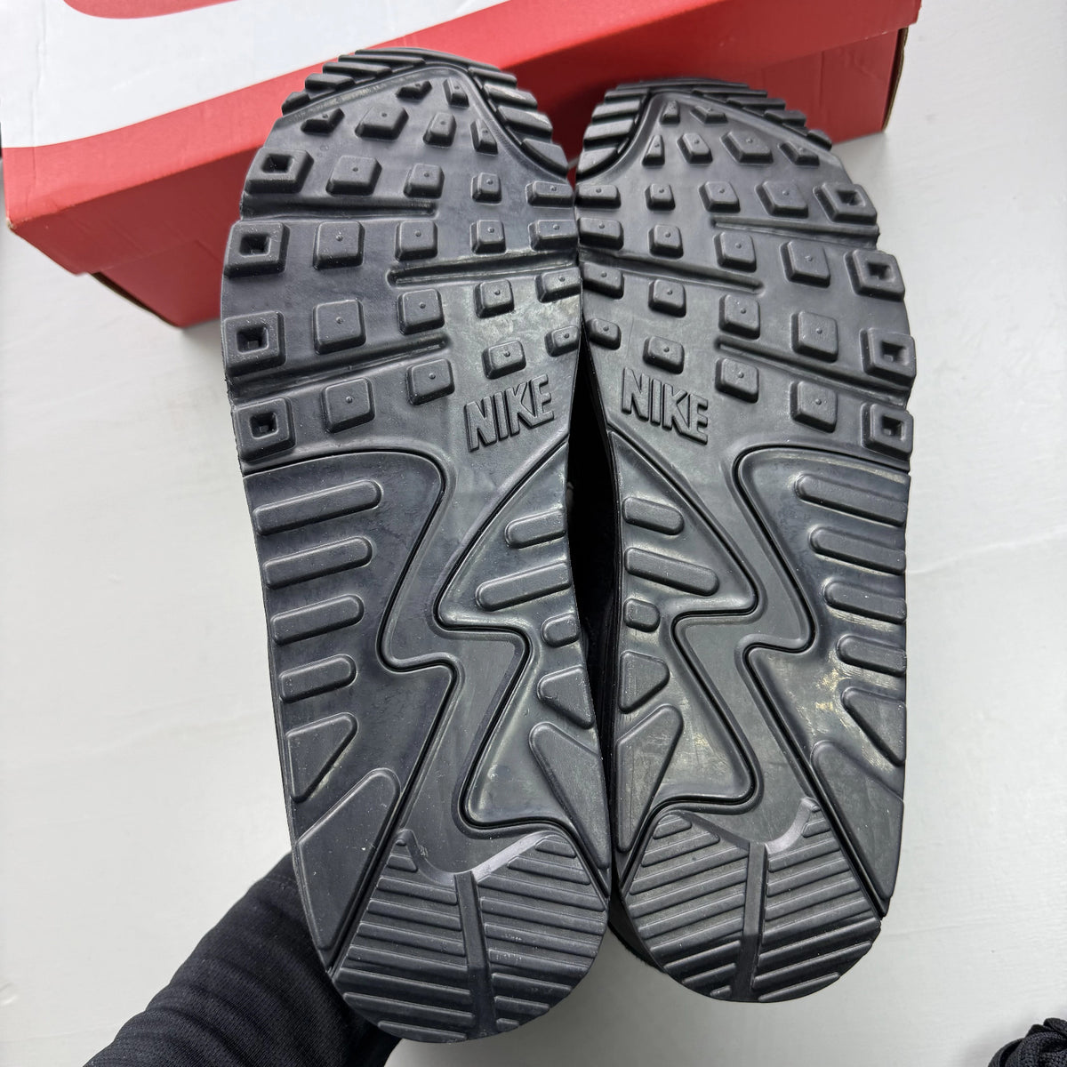 Nike Air Max 90 black trainers with volt and cool grey swoosh logo.