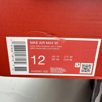Nike Air Max 95 grey trainers with sundial accents and signature logo details.