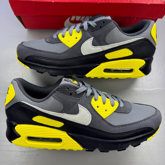 Nike trainers grey with yellow accents and Air Max branding on the side.
