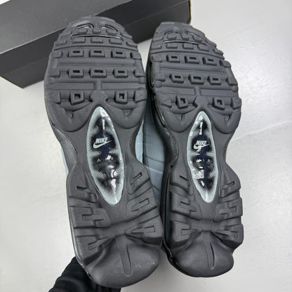 Nike running shoes grey with caution strip detailing and Air Max cushioning.