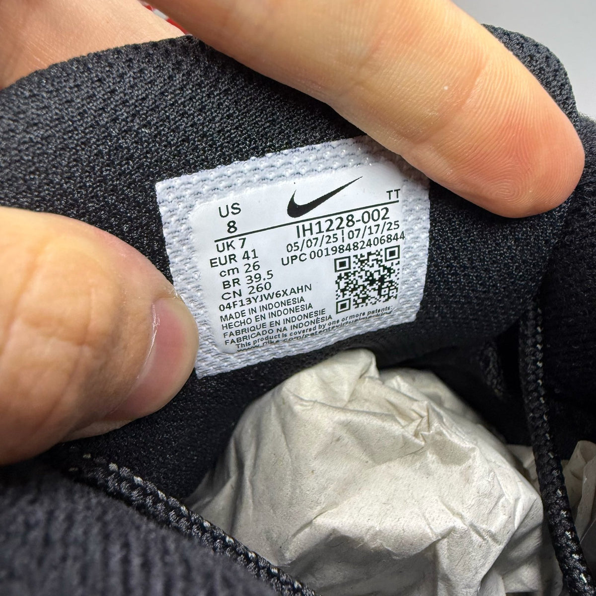 Nike Air Max 95 black trainers with green strike accents and textured upper.