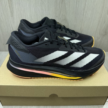 Adidas black trainers with white accents and distinctive Adizero branding.
