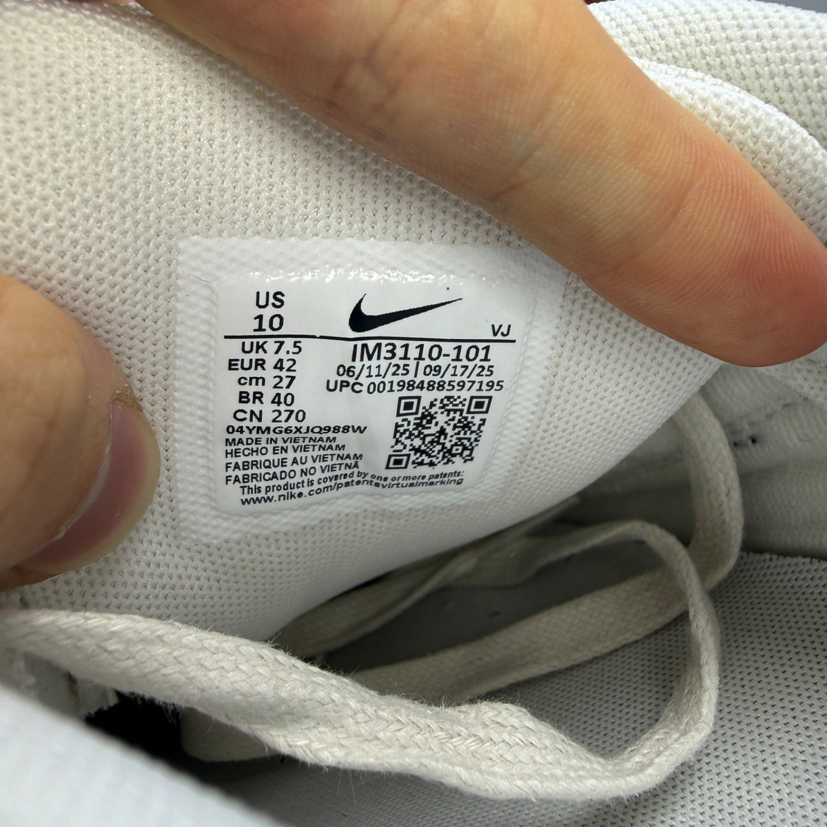Nike deck shoes white with croc print texture and logo detail.