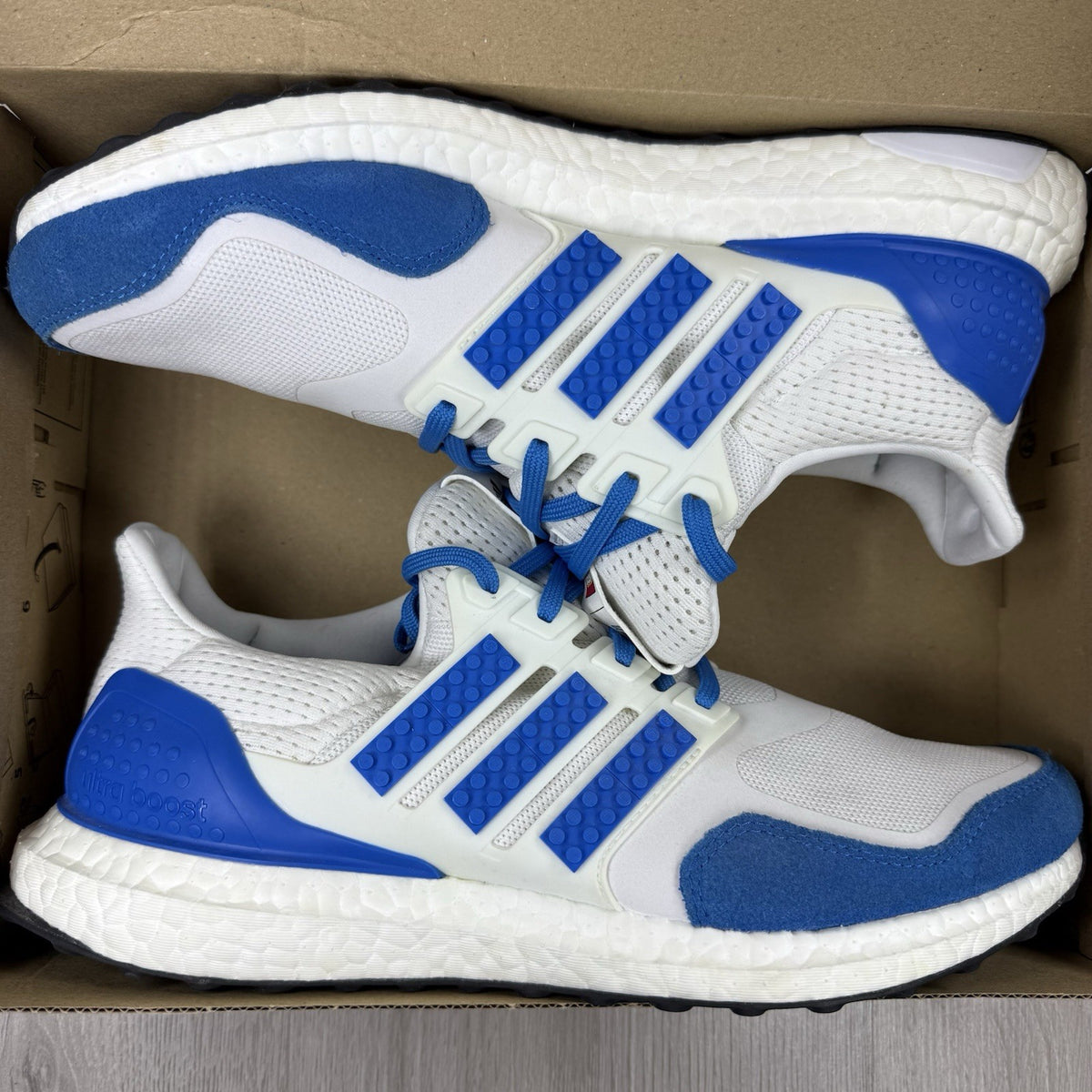 Adidas grey Ultra Boost trainers with blue accents and distinctive LEGO branding.
