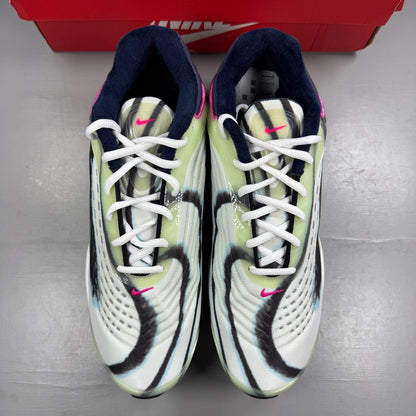 Nike trainers white with enamel green and silver accents, featuring unique design details.