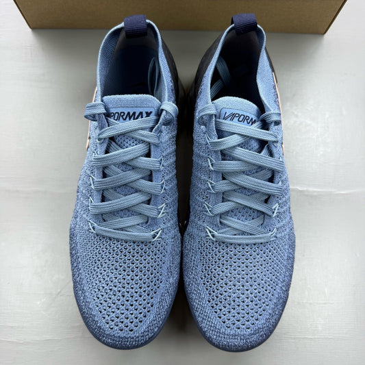 Nike blue trainers with Flyknit upper and Air cushioning technology.