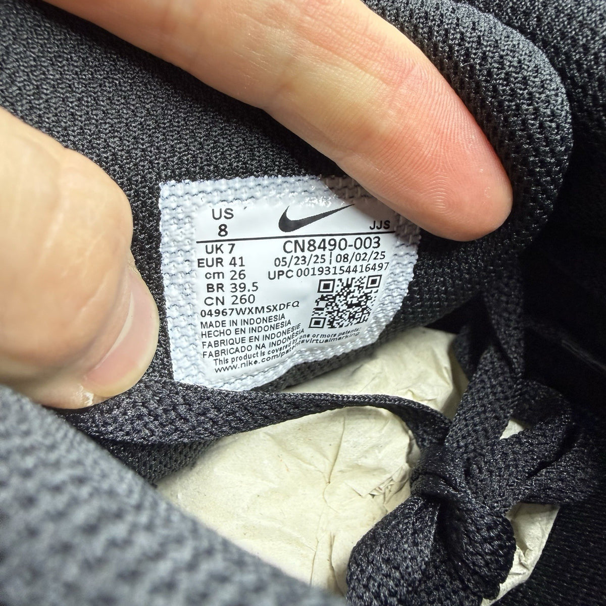 Nike Air Max 90 Recraft black trainers with textured upper and signature swoosh logo.