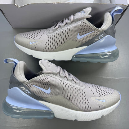Nike grey trainers with Air Max cushioning and logo detail on the tongue.