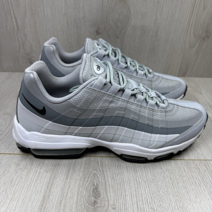 Nike Air Max 95 Ultra grey trainers with white accents and signature logo detailing.