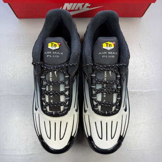 Nike deck shoes black with grey accents and gum sole, featuring iconic swoosh logo.